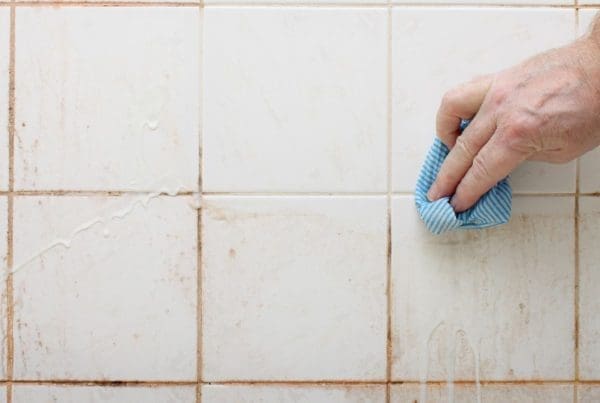 Image of dirt, stained shower from C and J Water.