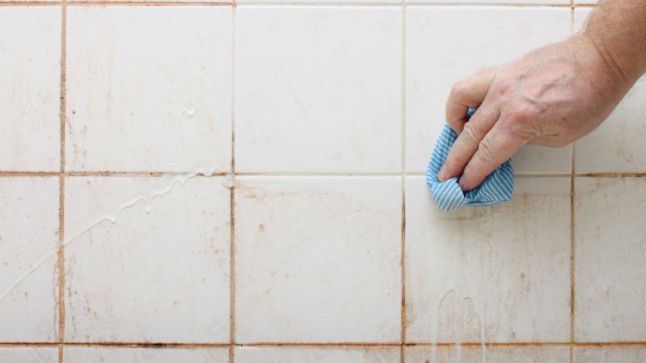 Image of dirt, stained shower from C and J Water.