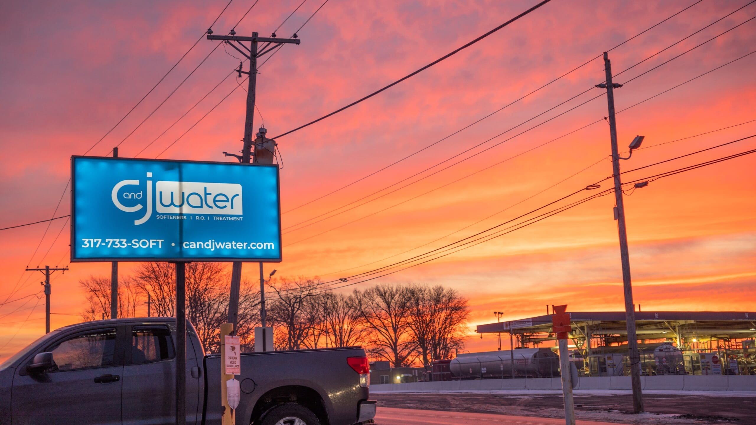 Sunset with C&J billboard.