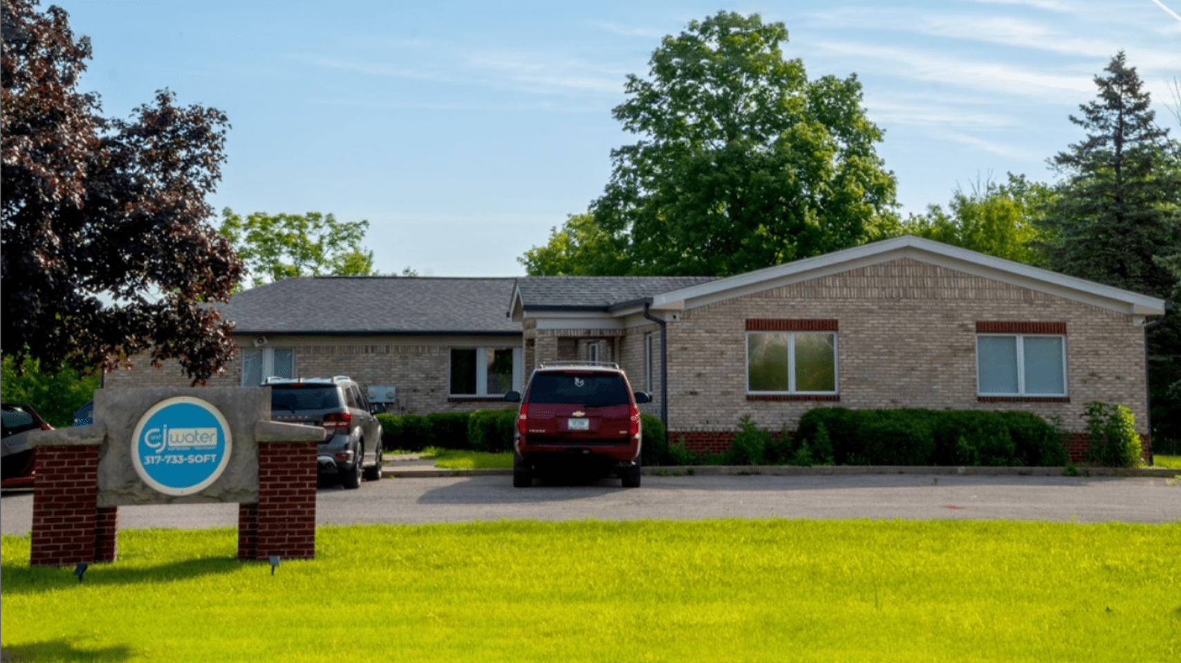 Brick office building with C&J sign.